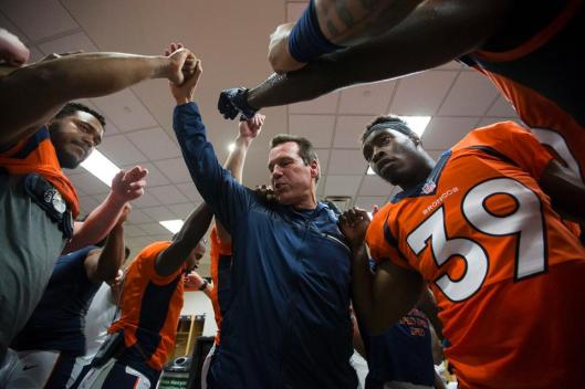 Broncos Head Coach Gary Kubiak congratulates his team after their win Saturday. (Denver Broncos photo by Gabriel Christus)